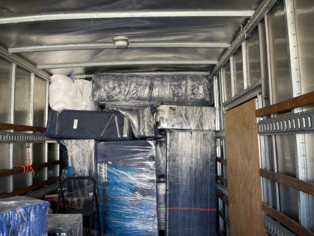 Movers on duty load a truck